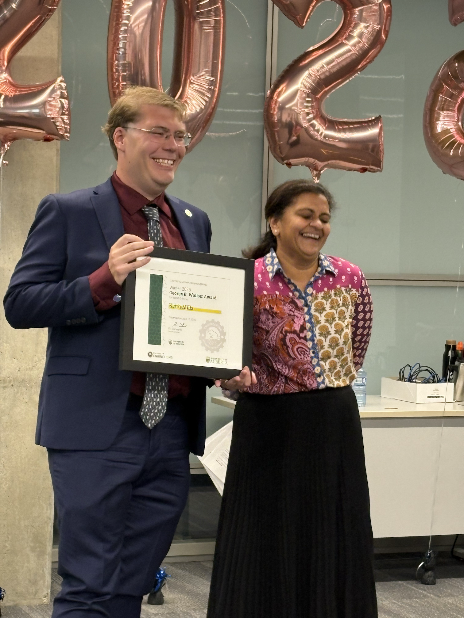 Accepting the award alongside Prof. Manisha Gupta, ECE Faculty and UAlberta Associate Dean of Engineering Graduate Students